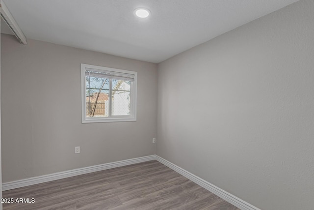 spare room featuring light wood-type flooring