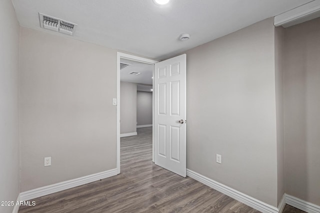 spare room featuring hardwood / wood-style floors