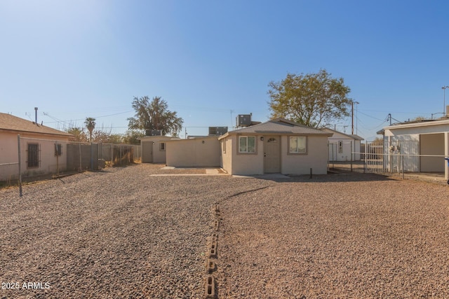 back of house featuring central air condition unit