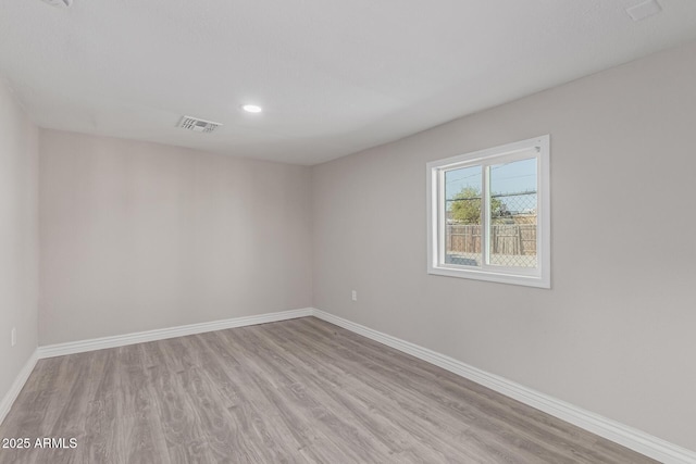 spare room with light wood-type flooring