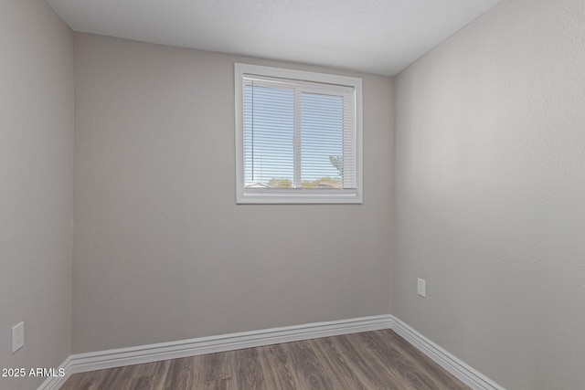 unfurnished room with hardwood / wood-style floors