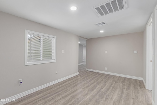 empty room featuring light hardwood / wood-style floors