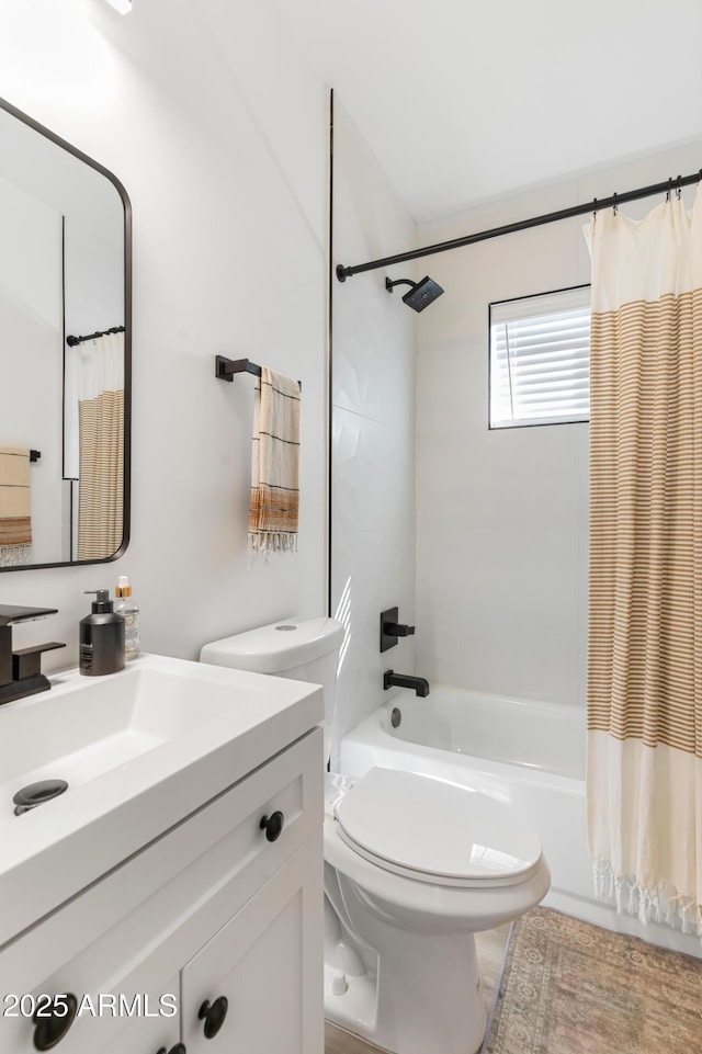 1212 E Indianola Ave, Phoenix, AZ 85014 - bathroom featuring shower / tub combo with curtain, vanity, and toilet