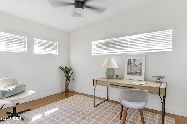 1212 E Indianola Ave, Phoenix, AZ 85014 - office area with baseboards, a ceiling fan, and a healthy amount of sunlight