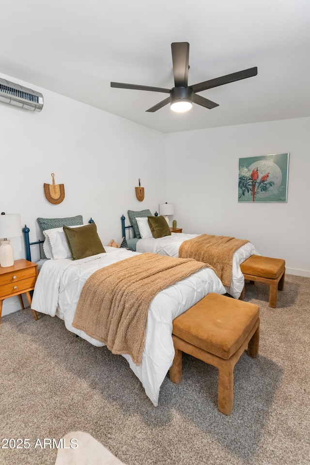 1212 E Indianola Ave, Phoenix, AZ 85014 - carpeted bedroom featuring a wall mounted air conditioner, ceiling fan, and baseboards