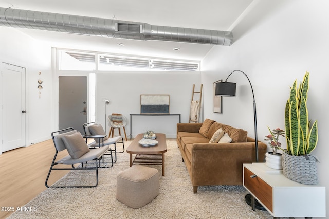 1212 E Indianola Ave, Phoenix, AZ 85014 - living area with light wood-style flooring and visible vents