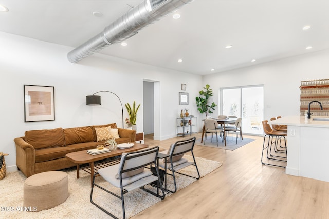 1212 E Indianola Ave, Phoenix, AZ 85014 - living room featuring recessed lighting, light wood finished floors, and baseboards