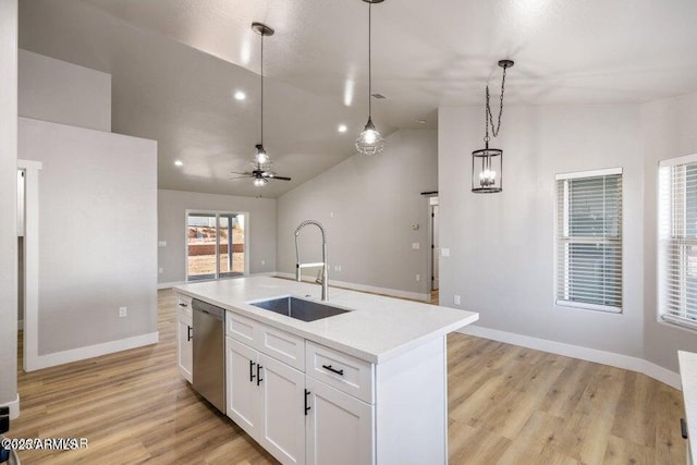 780 E Cobble Ln, Taylor, AZ 85939 - kitchen featuring a sink, stainless steel dishwasher, vaulted ceiling, open floor plan, and white cabinetry