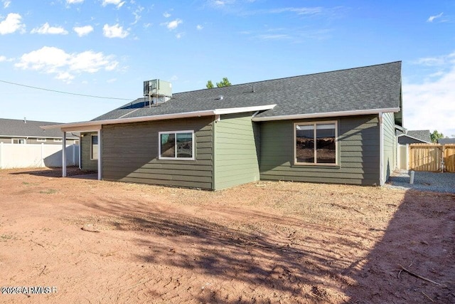 780 E Cobble Ln, Taylor, AZ 85939 - back of house featuring a shingled roof and central air condition unit
