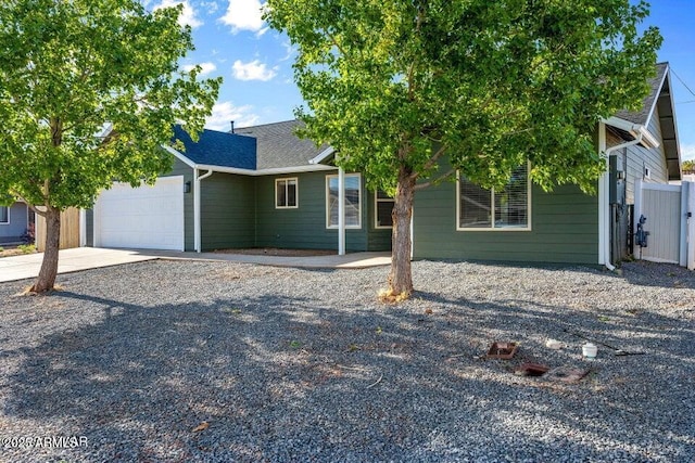 780 E Cobble Ln, Taylor, AZ 85939 - view of front of house with concrete driveway, a garage, and roof with shingles