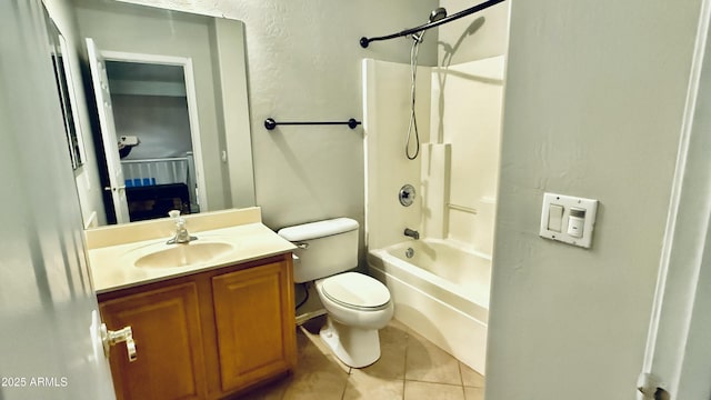 bathroom featuring vanity, toilet, tile patterned flooring, and shower / washtub combination