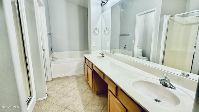 bathroom with tile patterned floors, a stall shower, and a sink