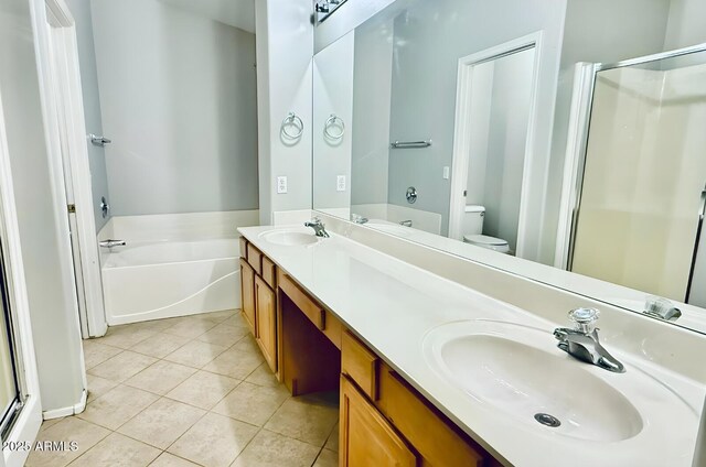 17059 W Northampton Rd, Surprise, AZ 85374 - full bath featuring a stall shower, tile patterned flooring, toilet, double vanity, and a bath
