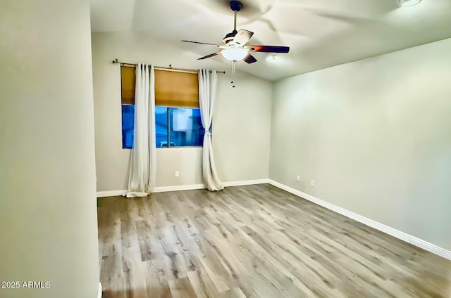 17059 W Northampton Rd, Surprise, AZ 85374 - unfurnished room with ceiling fan, wood finished floors, and baseboards