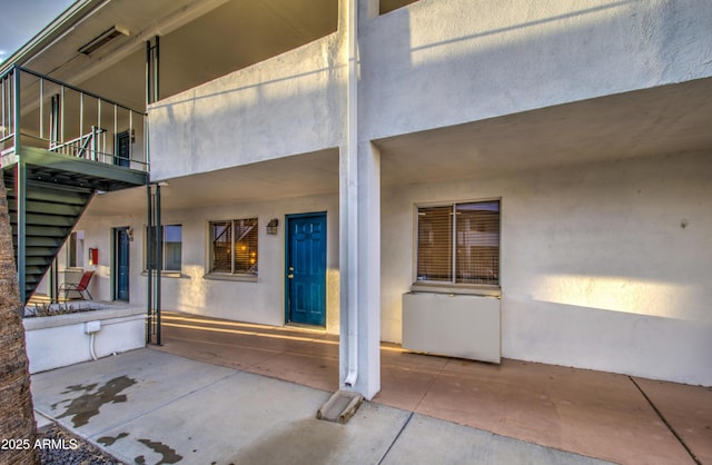 exterior space featuring visible vents and a balcony