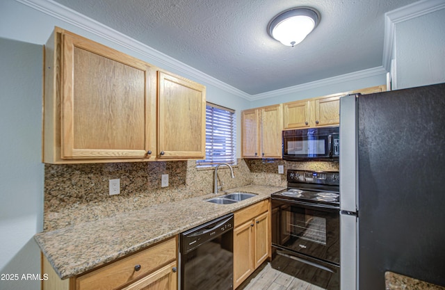 kitchen featuring a sink, backsplash, black appliances, and crown molding