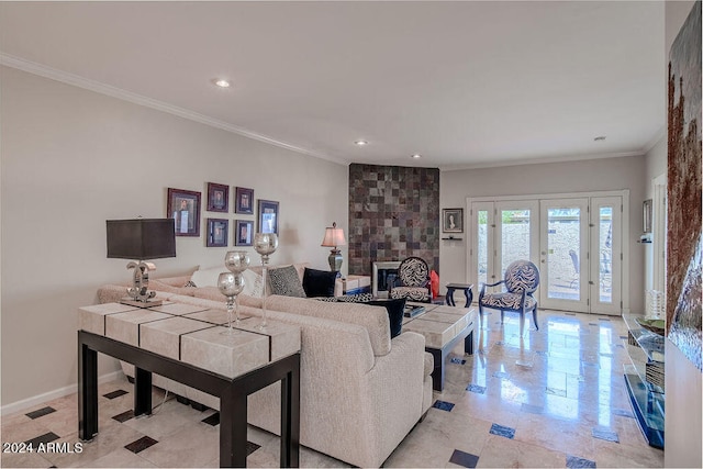 living room with ornamental molding, french doors, and a tile fireplace