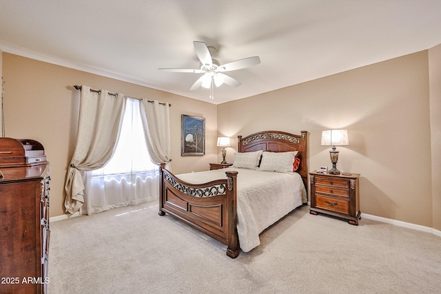 17404 N 99th Ave Unit 318, Sun City, AZ 85373 - bedroom featuring baseboards, ceiling fan, and light colored carpet