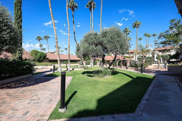 17404 N 99th Ave Unit 318, Sun City, AZ 85373 - surrounding community featuring a residential view and a lawn