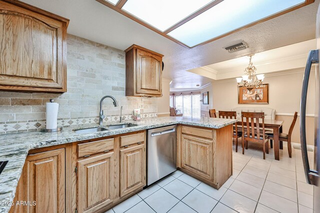 17404 N 99th Ave Unit 318, Sun City, AZ 85373 - kitchen with crown molding, light tile patterned flooring, visible vents, dishwasher, and a sink