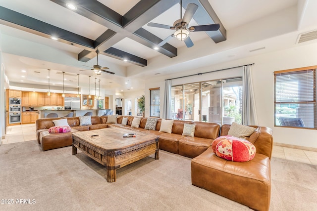 living room featuring ceiling fan, coffered ceiling, light tile patterned floors, and beam ceiling