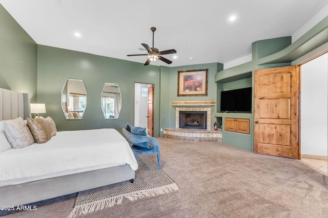 carpeted bedroom featuring a brick fireplace