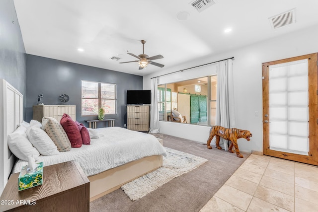 bedroom with light tile patterned floors and ceiling fan