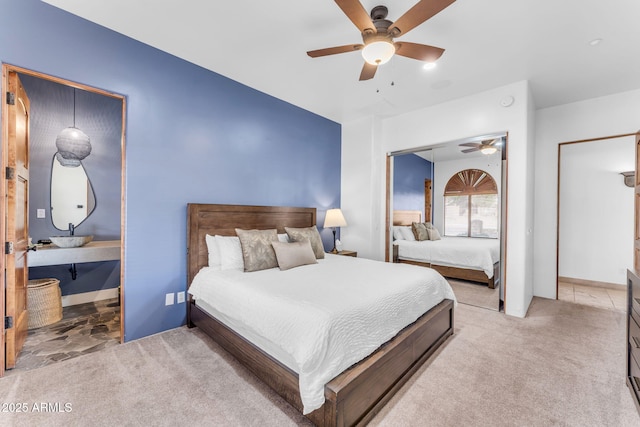 bedroom featuring ceiling fan and light carpet