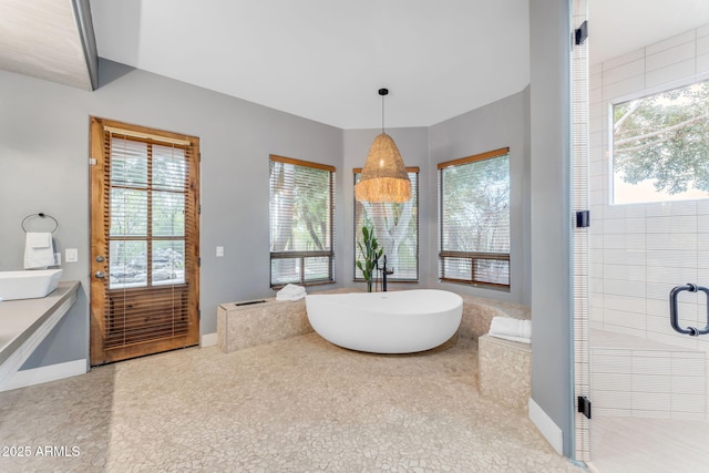 bathroom with shower with separate bathtub