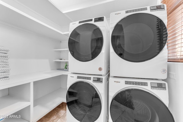 laundry area with stacked washer / dryer