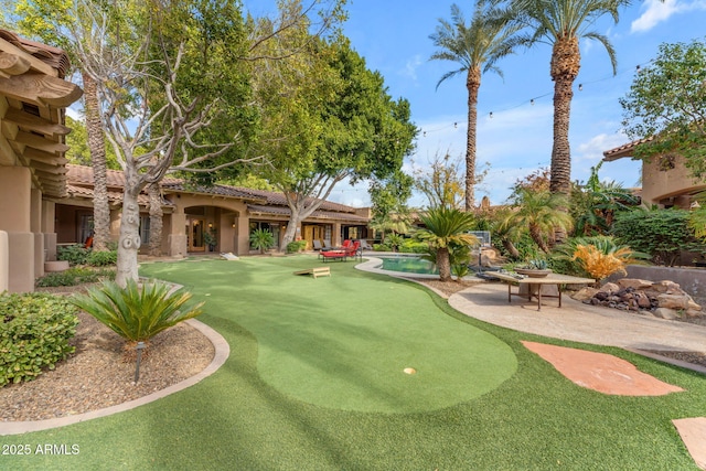 view of community with a patio