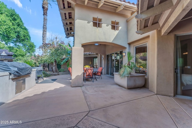 view of patio with a grill and an outdoor kitchen