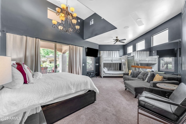 bedroom featuring multiple windows, access to outside, carpet, and a notable chandelier