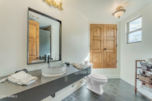 bathroom with sink and toilet