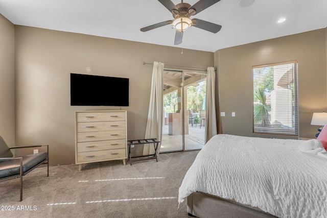 bedroom featuring ceiling fan, light colored carpet, and access to outside