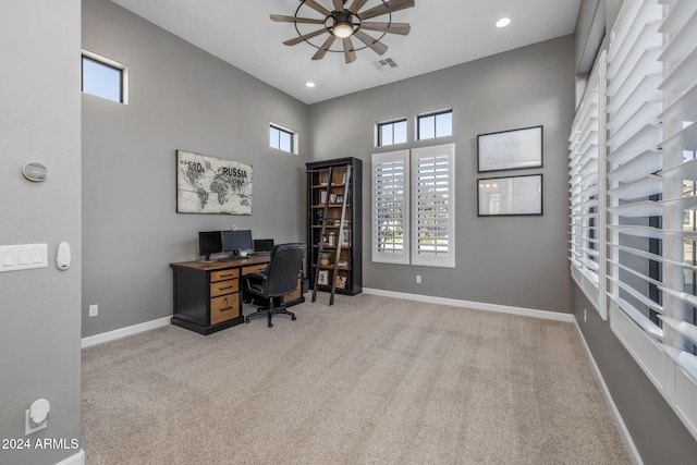 home office featuring ceiling fan and carpet