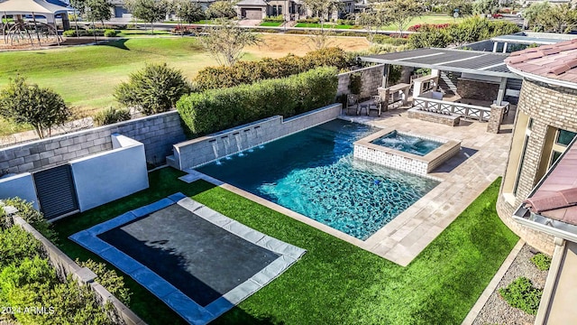 view of swimming pool with an in ground hot tub, area for grilling, a bar, and a lawn