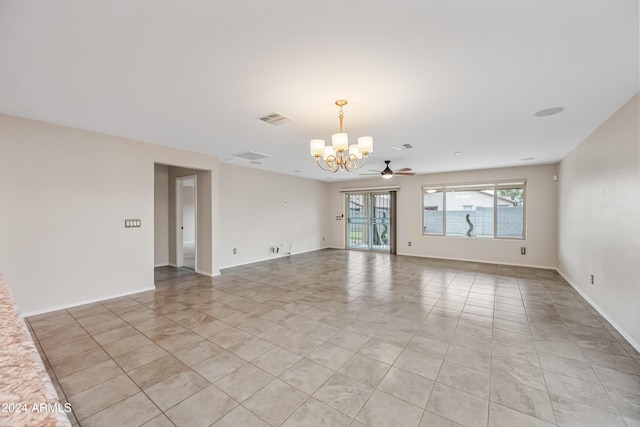 unfurnished room featuring light tile patterned floors and ceiling fan with notable chandelier