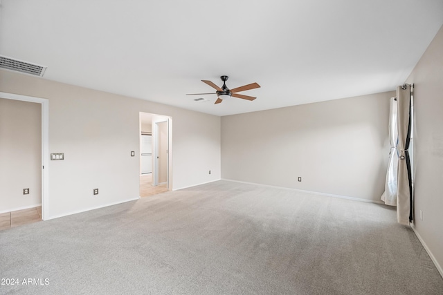 carpeted empty room with ceiling fan