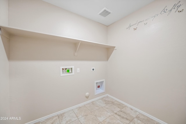 laundry area with hookup for a gas dryer, hookup for a washing machine, light tile patterned flooring, and hookup for an electric dryer