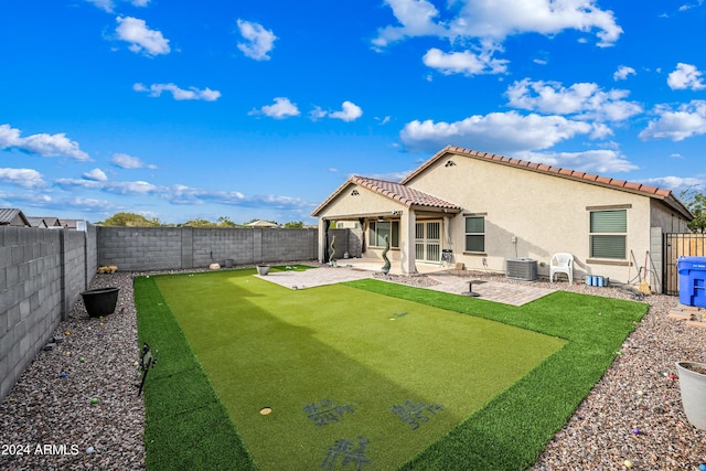 back of house with central AC unit and a patio area