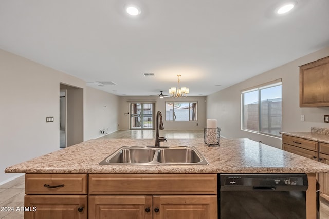 kitchen featuring a kitchen island with sink, dishwasher, ceiling fan with notable chandelier, and sink