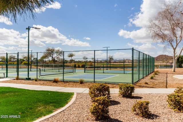 view of tennis court with fence