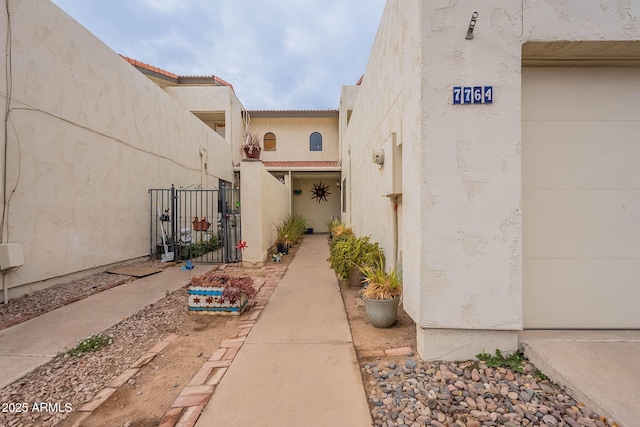 view of exterior entry featuring a garage