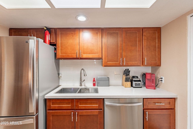 7764 N 19th Dr, Phoenix, AZ 85021 - kitchen featuring stainless steel appliances, sink, and backsplash