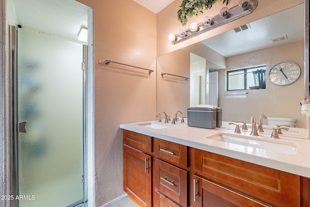 7764 N 19th Dr, Phoenix, AZ 85021 - bathroom with vanity, toilet, and a shower with shower door