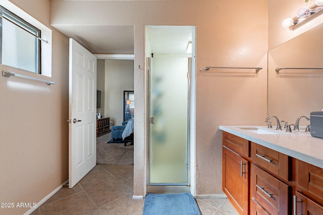 7764 N 19th Dr, Phoenix, AZ 85021 - bathroom featuring tile patterned floors, a shower with shower door, and vanity