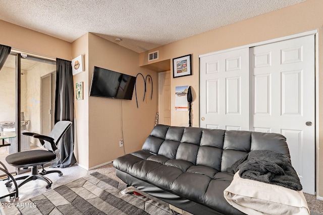 7764 N 19th Dr, Phoenix, AZ 85021 - living room with a textured ceiling and carpet flooring