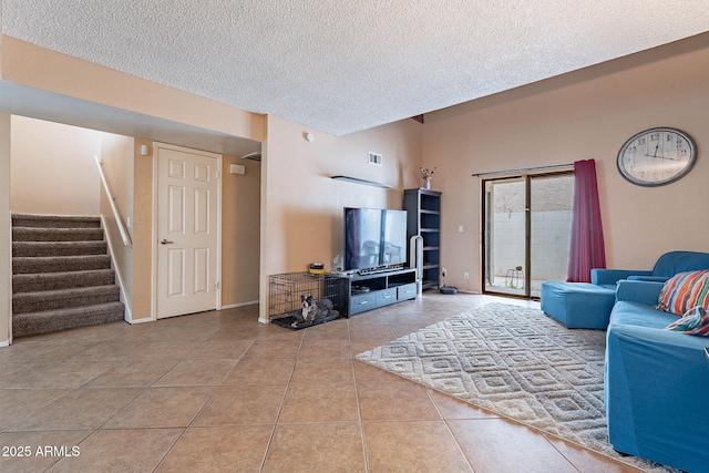 7764 N 19th Dr, Phoenix, AZ 85021 - living room with light tile patterned floors and a textured ceiling