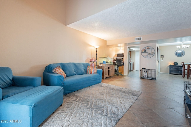 7764 N 19th Dr, Phoenix, AZ 85021 - tiled living room with a textured ceiling